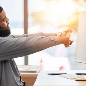 Call center computer, customer service or black man stretching for ergonomic health in CRM telemark.